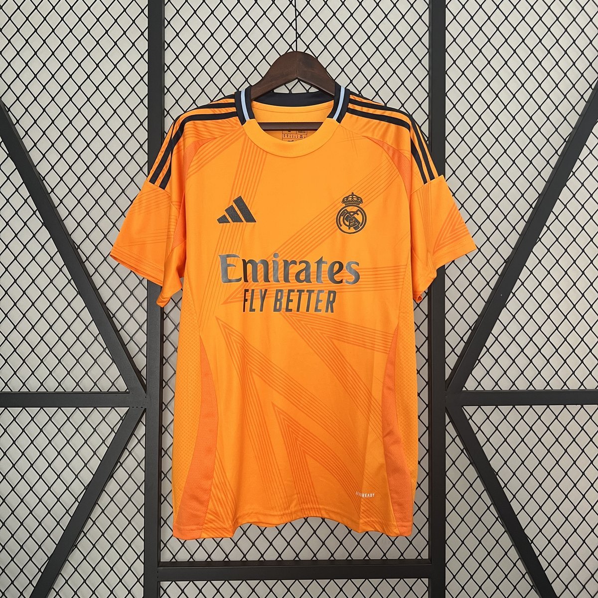 Real Madrid Away Jersey 2024-2025 - Orange with Black Linear Pattern — product photo