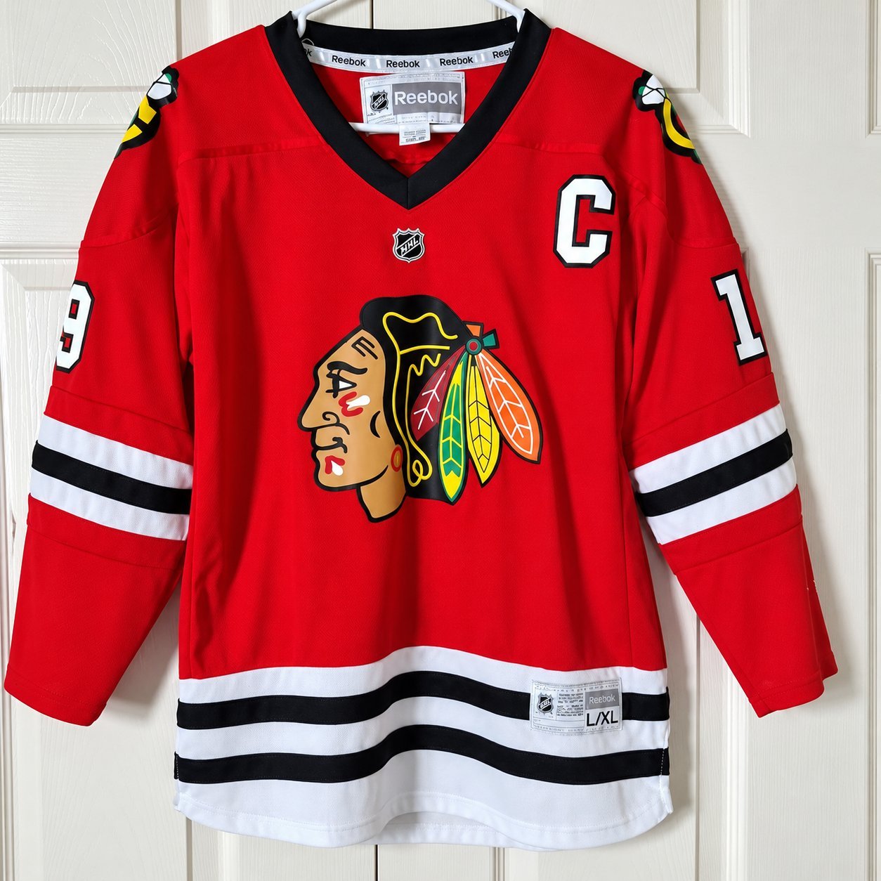 Blackhawks Reebok-era jersey with C captain patch and #1